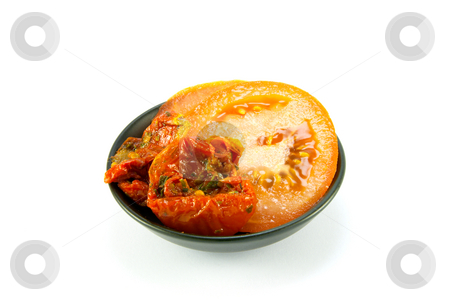 To use this stock image in your creative project, please select the size you need over to the right and click the "Add to Cart" button.
Your downloaded image will come with the Cutcaster watermark removed so don’t worry about the watermark you see on this page. Sun Dried Tomatoes and Tomato Slices stock photo, Sun dried tomatoes and slices of tomatoes in a small black bowl on a white background by Keith Wilson