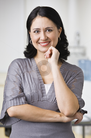 To use this stock image in your creative project, please select the size you need over to the right and click the "Add to Cart" button.
Your downloaded image will come with the Cutcaster watermark removed so don’t worry about the watermark you see on this page. Woman in Office stock photo, A young businesswoman is standing in an office and smiling at the camera. Vertically framed shot. by Jonathan Ross