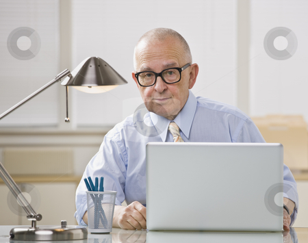 To use this stock image in your creative project, please select the size you need over to the right and click the "Add to Cart" button.
Your downloaded image will come with the Cutcaster watermark removed so don’t worry about the watermark you see on this page. Older man on laptop. stock photo, Older bald man with glasses on laptop. Desk lamp lighting from above. Horizontal. by Jonathan Ross