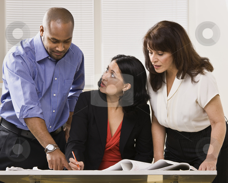To use this stock image in your creative project, please select the size you need over to the right and click the "Add to Cart" button.
Your downloaded image will come with the Cutcaster watermark removed so don’t worry about the watermark you see on this page. Women and Man Working in Office stock photo, A group of business people are in an office and are looking at some paperwork. They are talking and looking away from the camera. Horizontally framed shot. by Jonathan Ross