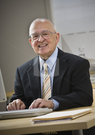 To use this stock image in your creative project, please select the size you need over to the right and click the "Add to Cart" button.
Your downloaded image will come with the Cutcaster watermark removed so don’t worry about the watermark you see on this page. Attractive senior male smiling at camera stock photo, Attractive senior male smiling at camera, working on keyboard at desk. Vertical by Jonathan Ross