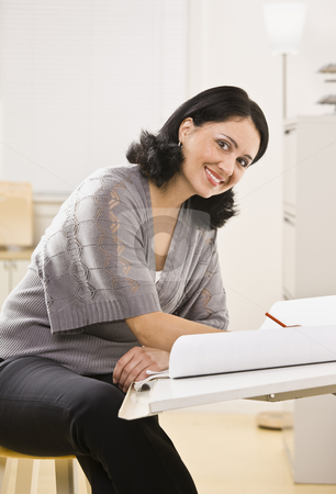 To use this stock image in your creative project, please select the size you need over to the right and click the "Add to Cart" button.
Your downloaded image will come with the Cutcaster watermark removed so don’t worry about the watermark you see on this page. Attractive brunette woman drawing. stock photo, Attractive brunette woman drawing on white paper on board, smiling at camera. Vertical by Jonathan Ross
