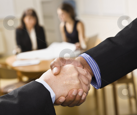 To use this stock image in your creative project, please select the size you need over to the right and click the "Add to Cart" button.
Your downloaded image will come with the Cutcaster watermark removed so don’t worry about the watermark you see on this page. Mixed race handshake. stock photo, Mixed race handshake with two woman in background. Horizontal by Jonathan Ross