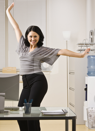 To use this stock image in your creative project, please select the size you need over to the right and click the "Add to Cart" button.
Your downloaded image will come with the Cutcaster watermark removed so don’t worry about the watermark you see on this page. Woman Posing in Office stock photo, A young woman is standing in an office and striking a pose. She is smilling at the camera. Vertically framed shot. by Jonathan Ross