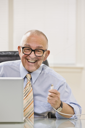 To use this stock image in your creative project, please select the size you need over to the right and click the "Add to Cart" button.
Your downloaded image will come with the Cutcaster watermark removed so don’t worry about the watermark you see on this page. Senior male happy with USB. stock photo, Senior male happy with USB chord in hand, smiling at camera. Vertical by Jonathan Ross