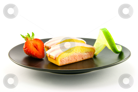 To use this stock image in your creative project, please select the size you need over to the right and click the "Add to Cart" button.
Your downloaded image will come with the Cutcaster watermark removed so don’t worry about the watermark you see on this page. Strawberry Slices on a Black Plate stock photo, Two pink strawberry sliced cakes with icing on the top with a half strawberry and twist of lime on a black plate on a white background by Keith Wilson