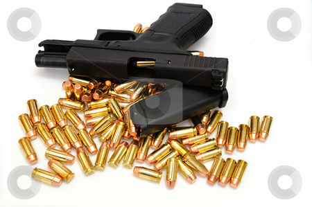 To use this stock image in your creative project, please select the size you need over to the right and click the "Add to Cart" button.
Your downloaded image will come with the Cutcaster watermark removed so don’t worry about the watermark you see on this page. Black Handgun And Bullets stock photo, A semi automatic pistol with an extra 10 round magazine, and many .40 caliber brass cartridges. The weapon is locked open showing a cartridge ready to enter the chamber. by Lynn Bendickson