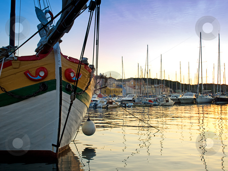 To use this stock image in your creative project, please select the size you need over to the right and click the "Add to Cart" button.
Your downloaded image will come with the Cutcaster watermark removed so don’t worry about the watermark you see on this page. Harbor of Losinj stock photo, View of the quiet port of Losinj in the summer twilight. by Sinisa Botas