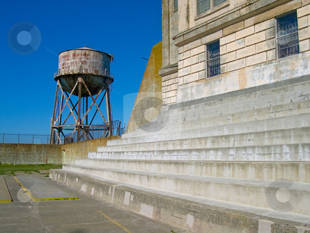 To use this stock image in your creative project, please select the size you need over to the right and click the "Add to Cart" button.
Your downloaded image will come with the Cutcaster watermark removed so don’t worry about the watermark you see on this page. Alcatraz water tank stock photo, Water tank and steps on Alcatraz by Jaime Pharr