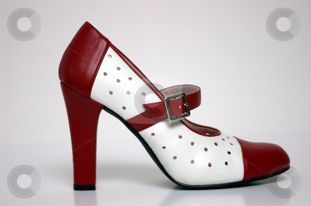 To use this stock image in your creative project, please select the size you need over to the right and click the "Add to Cart" button.
Your downloaded image will come with the Cutcaster watermark removed so don’t worry about the watermark you see on this page. High Heel stock photo, A side view of a red and white high heel on white. by Tom Weatherhead