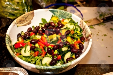 To use this stock image in your creative project, please select the size you need over to the right and click the "Add to Cart" button.
Your downloaded image will come with the Cutcaster watermark removed so don’t worry about the watermark you see on this page. Greek Salad stock photo, Greek salad is essentially a tomato salad made of sliced or chopped tomatoes with a few slices of cucumber, red onion, feta cheese, and kalamata olives, seasoned with salt, black pepper, oregano, and basil and dressed with olive oil. by Mariusz Jurgielewicz