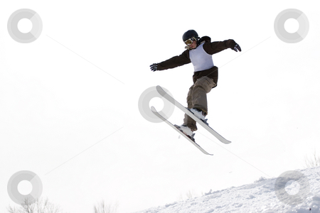 To use this stock image in your creative project, please select the size you need over to the right and click the "Add to Cart" button.
Your downloaded image will come with the Cutcaster watermark removed so don’t worry about the watermark you see on this page. Ski Jumper stock photo, A skier catching some major air after launching off of a jump. by Todd Arena