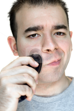 To use this stock image in your creative project, please select the size you need over to the right and click the "Add to Cart" button.
Your downloaded image will come with the Cutcaster watermark removed so don’t worry about the watermark you see on this page. Young Man Shaving stock photo, A closeup of a young man shaving his beard off with an electric shaver. by Todd Arena