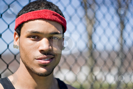 To use this stock image in your creative project, please select the size you need over to the right and click the "Add to Cart" button.
Your downloaded image will come with the Cutcaster watermark removed so don’t worry about the watermark you see on this page. Basketball Player Portrait stock photo, A portrait of a young basketball player at the basketball court in the park. by Todd Arena