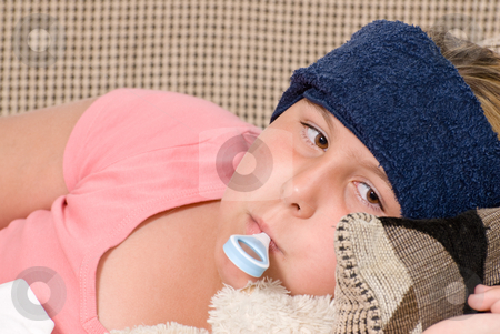 To use this stock image in your creative project, please select the size you need over to the right and click the "Add to Cart" button.
Your downloaded image will come with the Cutcaster watermark removed so don’t worry about the watermark you see on this page. Fever stock photo, Closeup view of a young girl with a thermometer in her mouth and a damp cool cloth on her forehead, indicating she has a fever by Richard Nelson