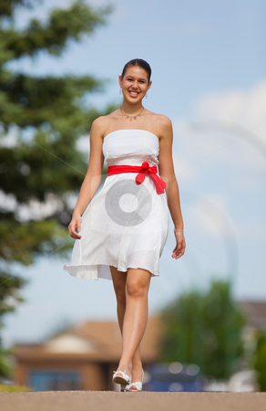 To use this stock image in your creative project, please select the size you need over to the right and click the "Add to Cart" button.
Your downloaded image will come with the Cutcaster watermark removed so don’t worry about the watermark you see on this page. White dress stock photo, Beautiful young woman walking in a city park by Steve Mcsweeny