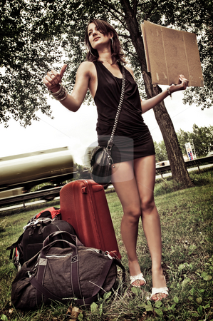 To use this stock image in your creative project, please select the size you need over to the right and click the "Add to Cart" button.
Your downloaded image will come with the Cutcaster watermark removed so don’t worry about the watermark you see on this page. Hitch hiking stock photo, Young woman with a lot of luggage, trying to get a ride by hitchiking. by Corepics VOF