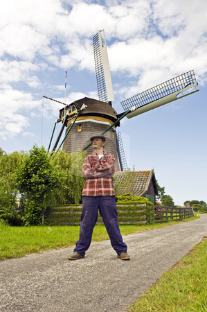 To use this stock image in your creative project, please select the size you need over to the right and click the "Add to Cart" button.
Your downloaded image will come with the Cutcaster watermark removed so don’t worry about the watermark you see on this page. Miller stock photo, Sturdy miller in front of a classic Dutch Windmill by Corepics VOF