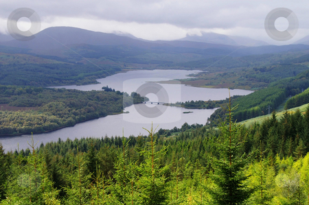 To use this stock image in your creative project, please select the size you need over to the right and click the "Add to Cart" button.
Your downloaded image will come with the Cutcaster watermark removed so don’t worry about the watermark you see on this page. Scenic valley stock photo, Scenic valley in the scottish higlands at autumn by Karin Claus