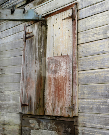 To use this stock image in your creative project, please select the size you need over to the right and click the "Add to Cart" button.
Your downloaded image will come with the Cutcaster watermark removed so don’t worry about the watermark you see on this page. Weathered wooden barn doors stock photo, A pair of weathered and rustic wooden barn doors by Jill Reid