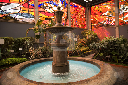 To use this stock image in your creative project, please select the size you need over to the right and click the "Add to Cart" button.
Your downloaded image will come with the Cutcaster watermark removed so don’t worry about the watermark you see on this page. Cosmovitral Garden with Fountain Toluca Mexico stock photo, Cosmovitral is a very famous botanical garden in Toluca, Mexico, which is surrounged with stained glass. This is one of the fountains. by William Perry