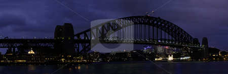 To use this stock image in your creative project, please select the size you need over to the right and click the "Add to Cart" button.
Your downloaded image will come with the Cutcaster watermark removed so don’t worry about the watermark you see on this page. Sydney Harbour Bridge stock photo, The Sydney Harbour Bridge is a steel arch bridge across Sydney Harbour that carries rail, vehicular and pedestrian traffic between the Sydney central business district and the North Shore. The dramatic view of the bridge, the harbour, and the nearby Sydney Opera House is an iconic image of both Sydney and Australia. The bridge is locally nicknamed