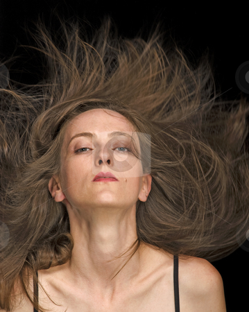 To use this stock image in your creative project, please select the size you need over to the right and click the "Add to Cart" button.
Your downloaded image will come with the Cutcaster watermark removed so don’t worry about the watermark you see on this page. Fly Hair stock photo, Fly hair fashion hair style by Desislava Draganova