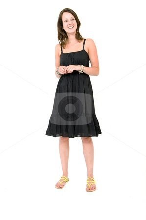 To use this stock image in your creative project, please select the size you need over to the right and click the "Add to Cart" button.
Your downloaded image will come with the Cutcaster watermark removed so don’t worry about the watermark you see on this page. Woman - Natural stock photo, Full body portrait of a young brunette woman in a black summer dress, smiling, unforced by Corepics VOF