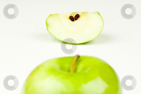 To use this stock image in your creative project, please select the size you need over to the right and click the "Add to Cart" button.
Your downloaded image will come with the Cutcaster watermark removed so don’t worry about the watermark you see on this page. Apple and Slice stock photo, An apple top and apple slice by Patrick Noonan