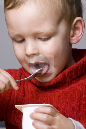 To use this stock image in your creative project, please select the size you need over to the right and click the "Add to Cart" button.
Your downloaded image will come with the Cutcaster watermark removed so don’t worry about the watermark you see on this page. Boy eating yogurt stock photo, Little Boy eating yogurt by Jandrie Lombard
