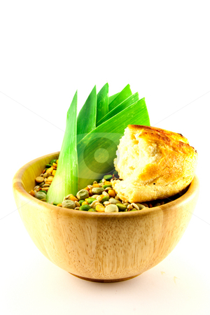 To use this stock image in your creative project, please select the size you need over to the right and click the "Add to Cart" button.
Your downloaded image will come with the Cutcaster watermark removed so don’t worry about the watermark you see on this page. Soup Pulses with Leek and Crusty Bread stock photo, Wooden bowl of soup pulses with leek and crusty bread on a white background by Keith Wilson