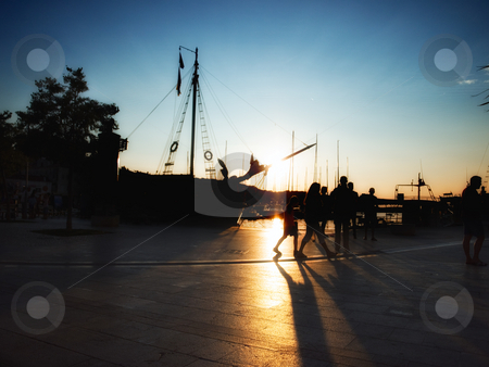 To use this stock image in your creative project, please select the size you need over to the right and click the "Add to Cart" button.
Your downloaded image will come with the Cutcaster watermark removed so don’t worry about the watermark you see on this page. Silhouettes of the Mediterranean stock photo, Evening scene common to every port in the Adriatic Sea by Sinisa Botas