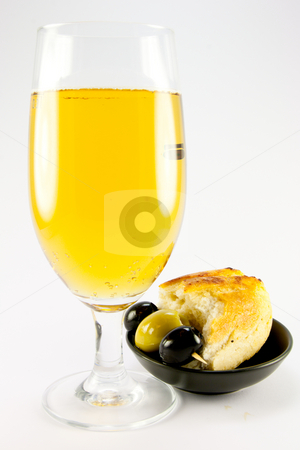 To use this stock image in your creative project, please select the size you need over to the right and click the "Add to Cart" button.
Your downloaded image will come with the Cutcaster watermark removed so don’t worry about the watermark you see on this page. Glass of Lager with Crusty Bread and Olives stock photo, Glass of lager with three green olives and piece of crusty bread in a small black bowl on a plain background by Keith Wilson