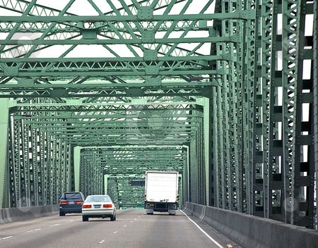 To use this stock image in your creative project, please select the size you need over to the right and click the "Add to Cart" button.
Your downloaded image will come with the Cutcaster watermark removed so don’t worry about the watermark you see on this page. Vehicles Driving Across Bridge stock photo, This photo shows vehicles in two cars and one truck driving across a green metal bridge on a road. by Valerie Garner