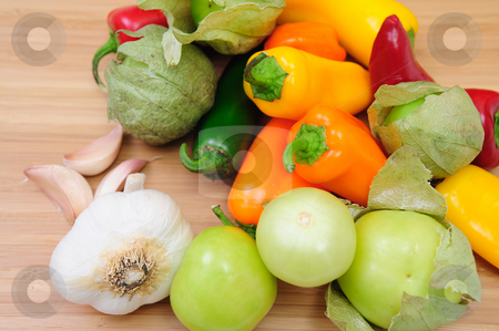 To use this stock image in your creative project, please select the size you need over to the right and click the "Add to Cart" button.
Your downloaded image will come with the Cutcaster watermark removed so don’t worry about the watermark you see on this page. Hot And Sweet Peppers stock photo, Colorful Hot and Sweet Peppers with Tomatillos and garlics cloves by Lynn Bendickson