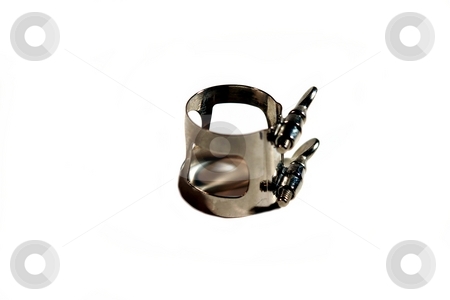 To use this stock image in your creative project, please select the size you need over to the right and click the "Add to Cart" button.
Your downloaded image will come with the Cutcaster watermark removed so don’t worry about the watermark you see on this page. Ligature stock photo, A metal silver clarinet ligature on white background. by Henrik Lehnerer