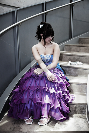 To use this stock image in your creative project, please select the size you need over to the right and click the "Add to Cart" button.
Your downloaded image will come with the Cutcaster watermark removed so don’t worry about the watermark you see on this page. Dateless on Prom Night stock photo, A young girl sits alone in her prom dress on a lonely flight of stairs. by Brenda Carson