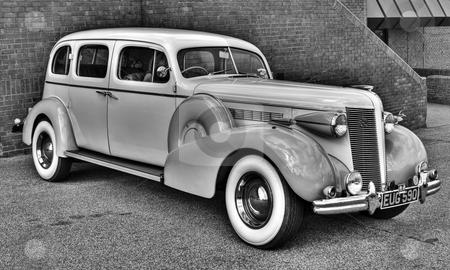 To use this stock image in your creative project, please select the size you need over to the right and click the "Add to Cart" button.
Your downloaded image will come with the Cutcaster watermark removed so don’t worry about the watermark you see on this page. Buick Saloon stock photo, Restored Buick car on display at Bournemouth by Robert Ford