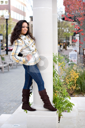 To use this stock image in your creative project, please select the size you need over to the right and click the "Add to Cart" button.
Your downloaded image will come with the Cutcaster watermark removed so don’t worry about the watermark you see on this page. Stylish Young Woman stock photo, A young woman posing around on a large pillar outside. by Todd Arena