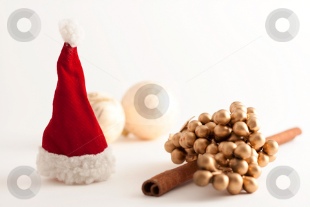 To use this stock image in your creative project, please select the size you need over to the right and click the "Add to Cart" button.
Your downloaded image will come with the Cutcaster watermark removed so don’t worry about the watermark you see on this page. Christmas Theme stock photo, Christmas balls, Santa Claus hat and a cinnamon stick by Alexander Zschach