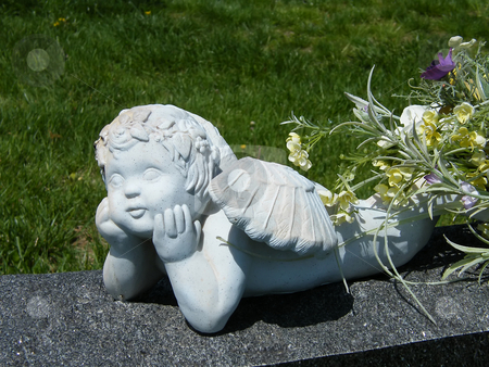 To use this stock image in your creative project, please select the size you need over to the right and click the "Add to Cart" button.
Your downloaded image will come with the Cutcaster watermark removed so don’t worry about the watermark you see on this page. Resting Guardian Angel stock photo, Resting Guardian Angel, setting on top of a grave marker. by Dazz Lee Photography