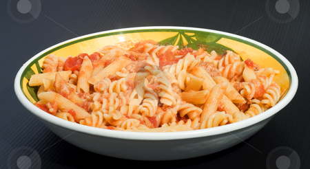 To use this stock image in your creative project, please select the size you need over to the right and click the "Add to Cart" button.
Your downloaded image will come with the Cutcaster watermark removed so don’t worry about the watermark you see on this page. Mixed Pasta stock photo, A plate full of italian pasta of two kind (fusilli and penne) over a black background by Fabio Alcini