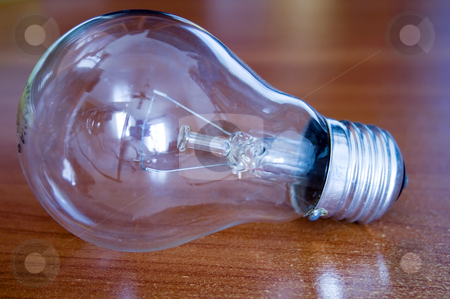 To use this stock image in your creative project, please select the size you need over to the right and click the "Add to Cart" button.
Your downloaded image will come with the Cutcaster watermark removed so don’t worry about the watermark you see on this page. Bulb stock photo, A bulb on a wooden table by Fabio Alcini