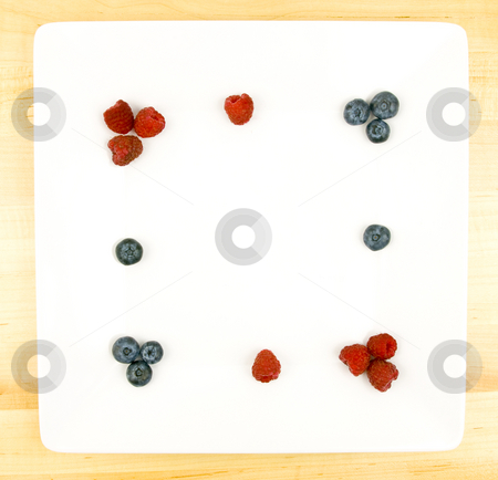 To use this stock image in your creative project, please select the size you need over to the right and click the "Add to Cart" button.
Your downloaded image will come with the Cutcaster watermark removed so don’t worry about the watermark you see on this page. Fruit Plate stock photo, Fruit Plate with raspberries, blue berries and copy space by John Teeter