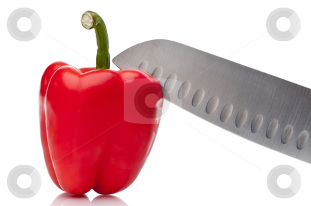 To use this stock image in your creative project, please select the size you need over to the right and click the "Add to Cart" button.
Your downloaded image will come with the Cutcaster watermark removed so don’t worry about the watermark you see on this page. A horizontal image of a red pepper bei ng sliced on white stock photo, A horizontal image of a red pepper bei ng sliced on white by Vince Clements