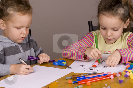 To use this stock image in your creative project, please select the size you need over to the right and click the "Add to Cart" button.
Your downloaded image will come with the Cutcaster watermark removed so don’t worry about the watermark you see on this page. Girl and boy drawing stock photo, Girl and boy drawing a picture at the table by Jandrie Lombard