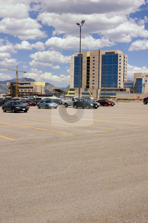 To use this stock image in your creative project, please select the size you need over to the right and click the "Add to Cart" button.
Your downloaded image will come with the Cutcaster watermark removed so don’t worry about the watermark you see on this page. Construction Site from the Parking Lot stock photo, Mirrored Construction Buildings and the Parking Lot with the Clouds in the Skies by Mehmet Dilsiz
