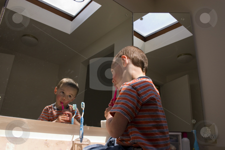To use this stock image in your creative project, please select the size you need over to the right and click the "Add to Cart" button.
Your downloaded image will come with the Cutcaster watermark removed so don’t worry about the watermark you see on this page. Little Boy Brushing his Teeth in Front of a Mirror stock photo, Little Boy Brushing his Teeth in Front of a Mirror sitting on the counter by Mehmet Dilsiz