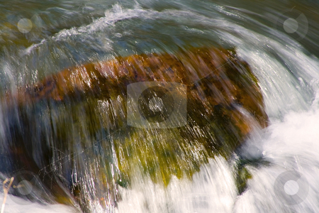 To use this stock image in your creative project, please select the size you need over to the right and click the "Add to Cart" button.
Your downloaded image will come with the Cutcaster watermark removed so don’t worry about the watermark you see on this page. River stock photo, Flowing water in River - Close up on a Rock by Mehmet Dilsiz
