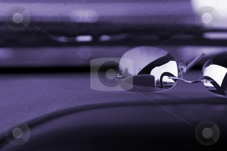 To use this stock image in your creative project, please select the size you need over to the right and click the "Add to Cart" button.
Your downloaded image will come with the Cutcaster watermark removed so don’t worry about the watermark you see on this page. Sunglasses on the deck stock photo, Steering wheel reflection on the sunglasses on the deck by Mehmet Dilsiz
